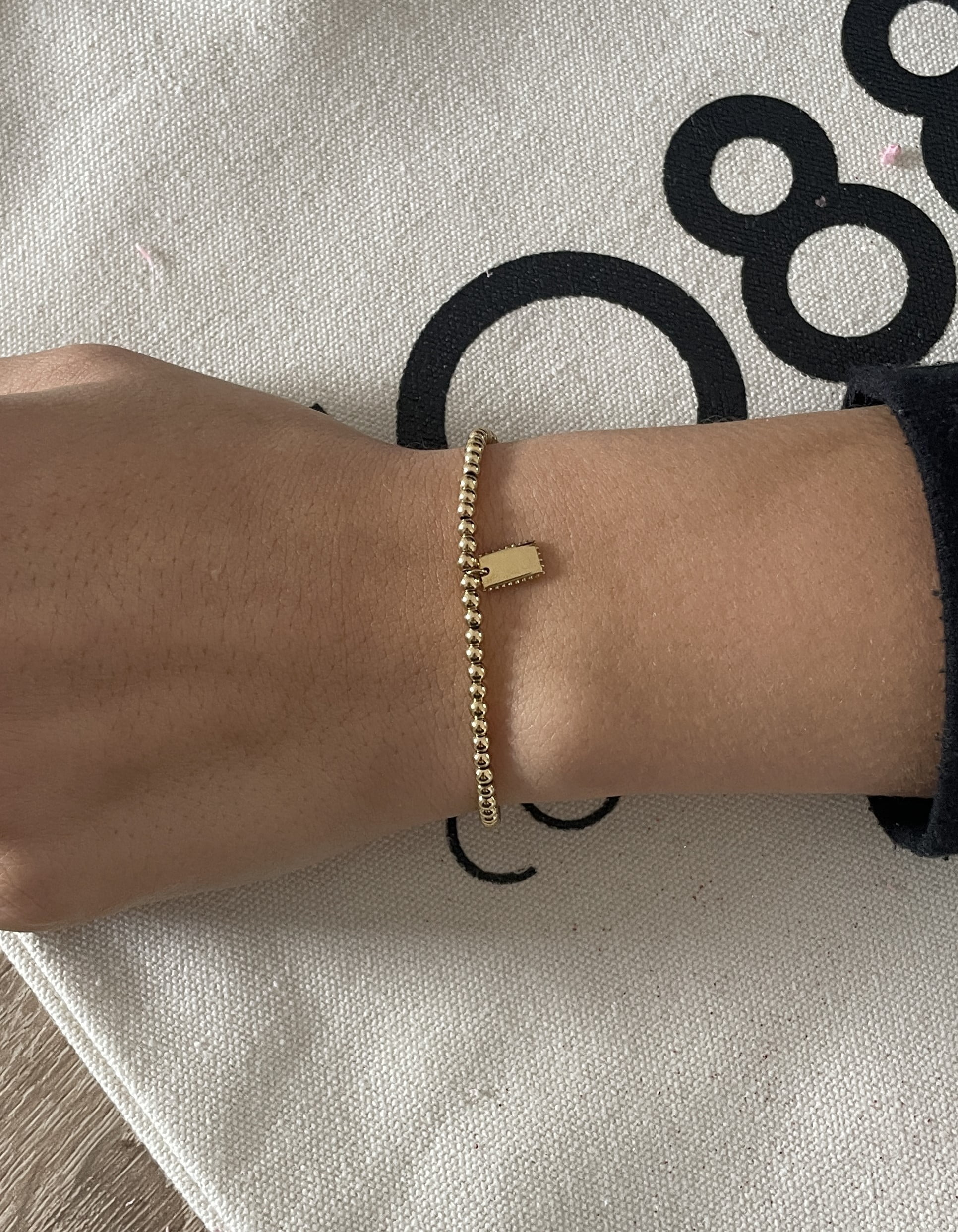 Bracelet Co88 France en acier inoxydable doré et pampille