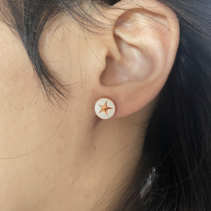 Boucle d'oreille, puce d'oreille Co88 France en acier inoxydable rose gold, motif étoile sur fond blanc