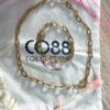 Composition collier et bracelet Co88 France en acier inoxydable doré et maille forçat